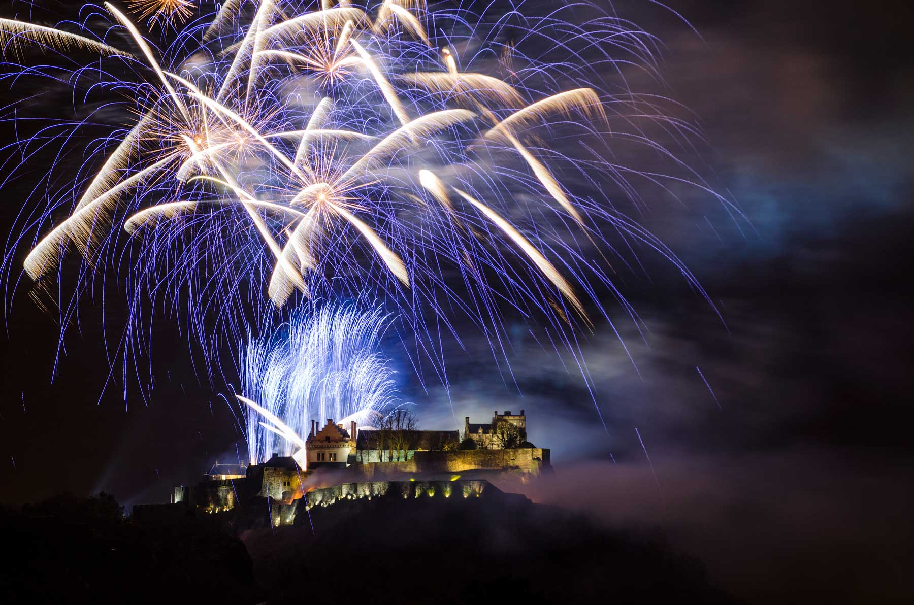 Stirling Castle with firework bursting in the sky