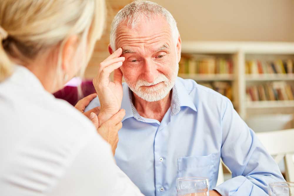 Elderly man getting support